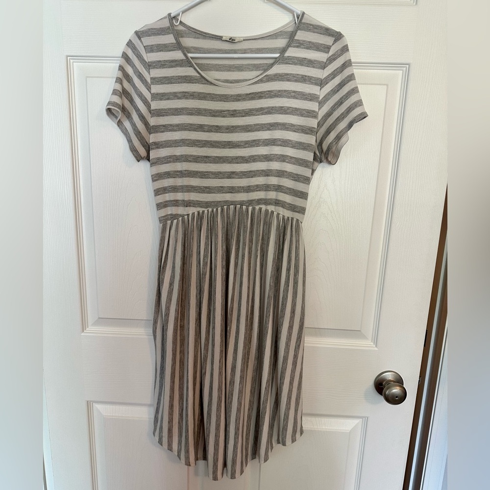 Light gray and white striped Egy Brand dress with pockets. Size medium.